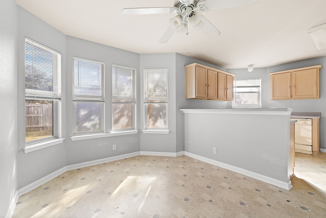 kitchen featuring dishwasher, a wealth of natural light, and light brown cabinets