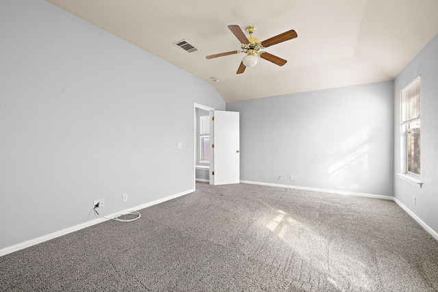 unfurnished room with carpet floors, ceiling fan, and vaulted ceiling