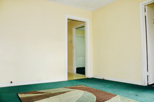 empty room featuring carpet floors