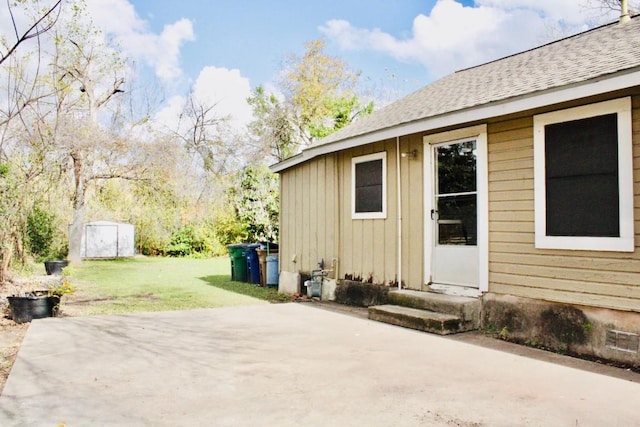 exterior space with a lawn and a patio