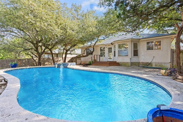 view of swimming pool with french doors