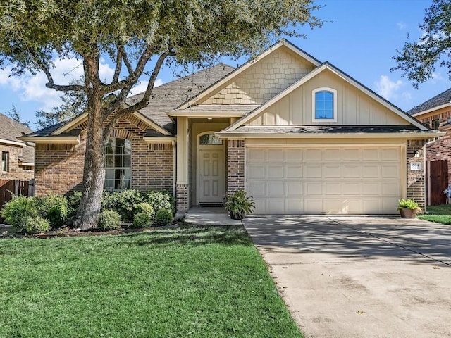 view of front of home with a garage and a front lawn