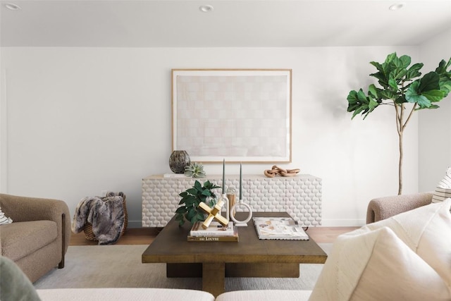 living room with wood finished floors and recessed lighting