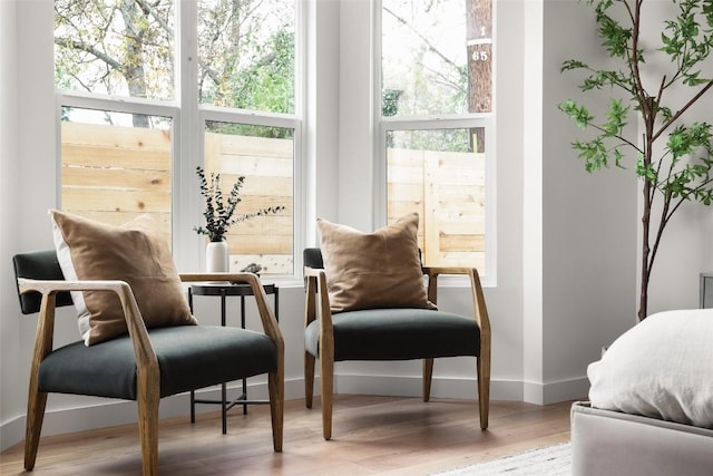 sitting room with hardwood / wood-style flooring