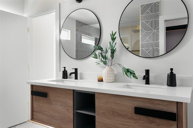 full bathroom featuring double vanity and a sink