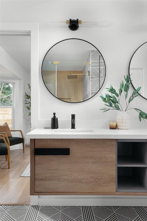 bathroom featuring vanity and hardwood / wood-style floors