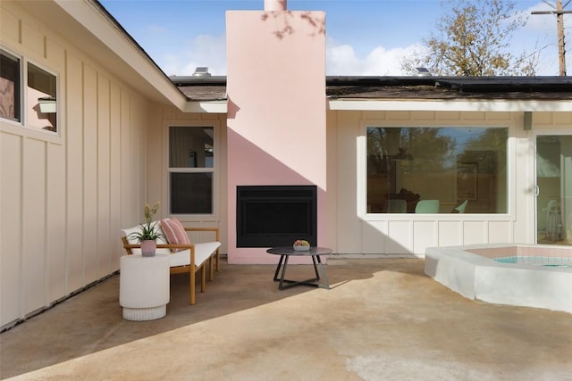 view of patio / terrace with a jacuzzi