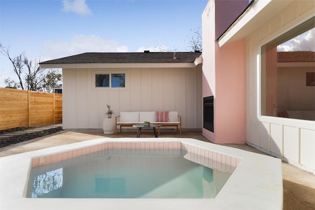 view of pool featuring an outdoor hangout area, a patio area, fence, and a fenced in pool