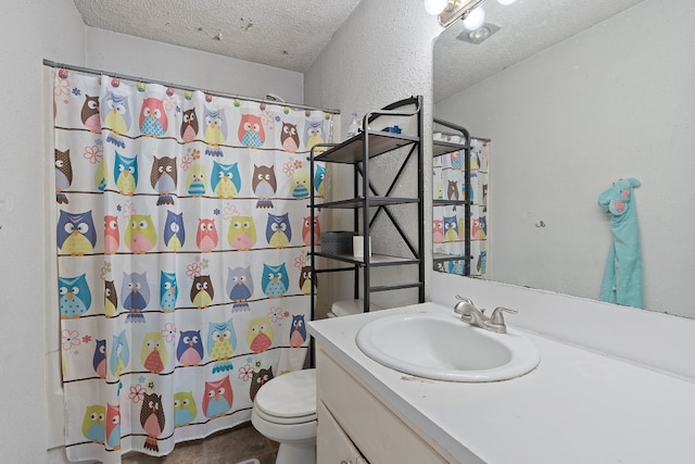 bathroom with curtained shower, vanity, a textured ceiling, and toilet