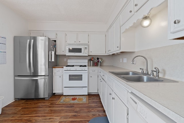 kitchen with white appliances, white cabinets, sink, a textured ceiling, and dark hardwood / wood-style flooring