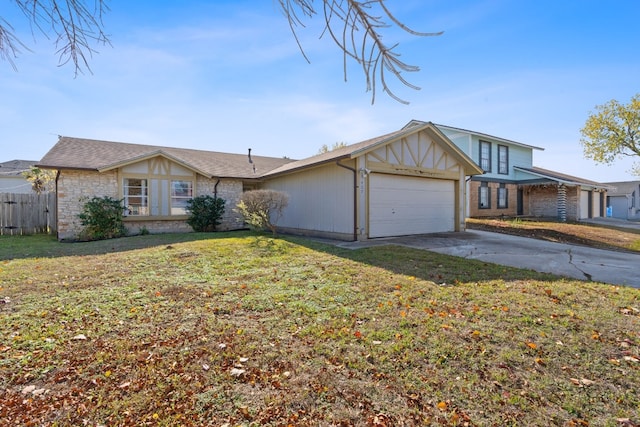 view of front of house with a front yard and a garage