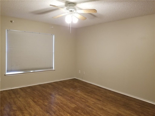 unfurnished room with a textured ceiling, ceiling fan, and dark wood-type flooring