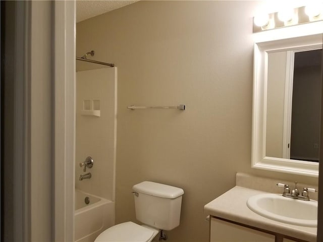 full bathroom with vanity, shower / bath combination, a textured ceiling, and toilet