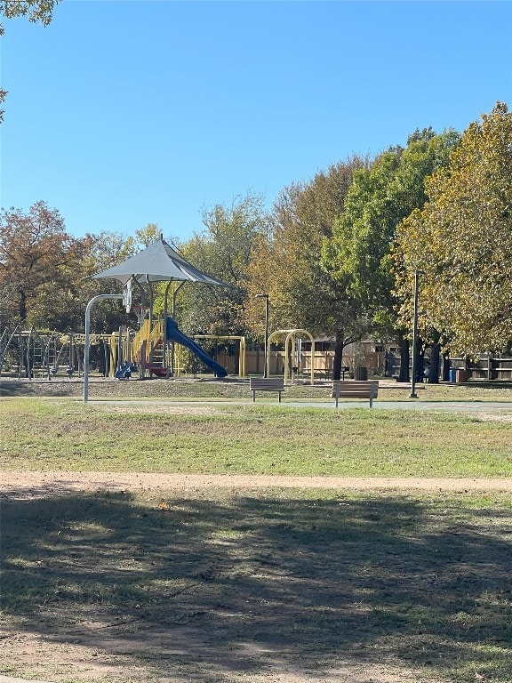 view of playground featuring a lawn