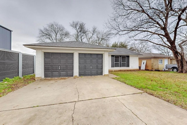 view of front of house with a front yard and a garage