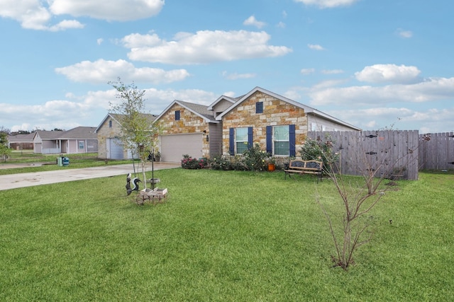 view of front of house featuring a front yard and a garage