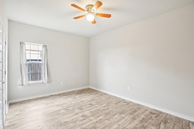 spare room featuring ceiling fan and light wood-type flooring