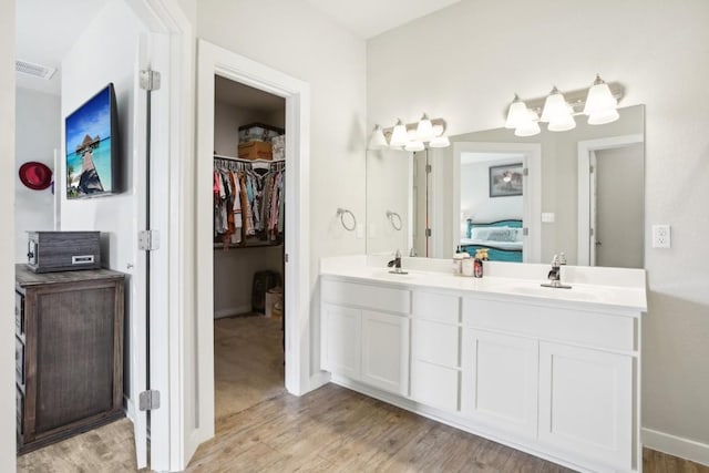 bathroom featuring vanity and hardwood / wood-style flooring