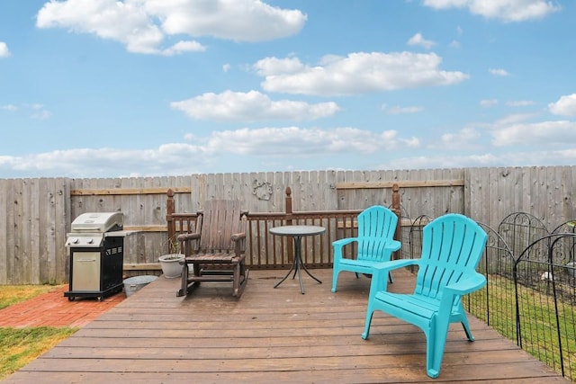 wooden deck featuring area for grilling