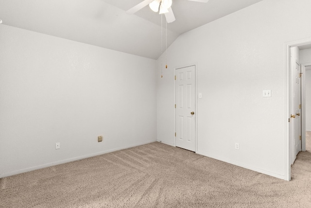 carpeted empty room featuring ceiling fan and lofted ceiling