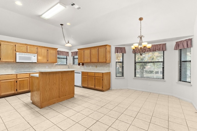 kitchen with an inviting chandelier, vaulted ceiling, decorative light fixtures, white appliances, and decorative backsplash