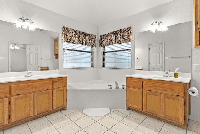 bathroom featuring a bathing tub, ceiling fan, tile patterned flooring, and vanity