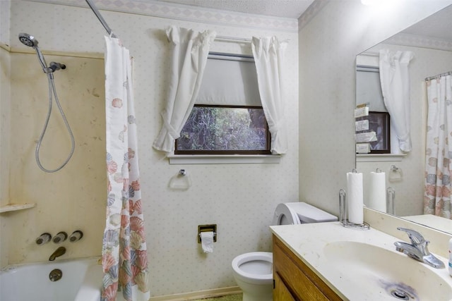 full bathroom with vanity, shower / bath combination with curtain, a textured ceiling, and toilet