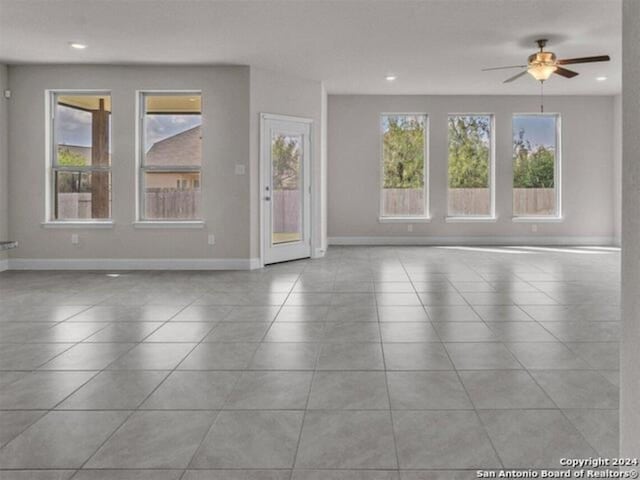 209 Filmore Fls, Cibolo, TX 78108 - unfurnished living room with tile patterned flooring, a ceiling fan, baseboards, and recessed lighting