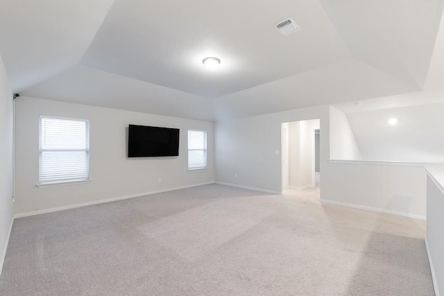 bonus room featuring light colored carpet