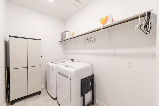 laundry room featuring light tile patterned flooring and independent washer and dryer