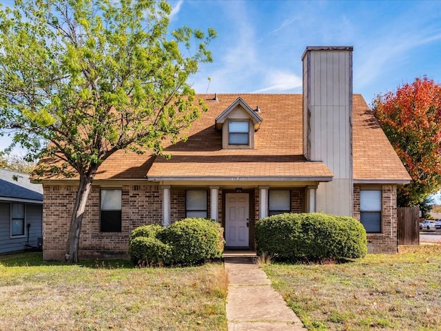 view of front of property with a front lawn