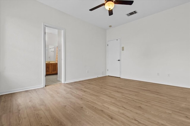 empty room featuring light wood-type flooring and ceiling fan