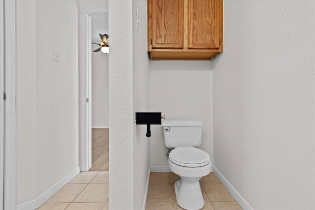 bathroom with tile patterned floors, ceiling fan, and toilet