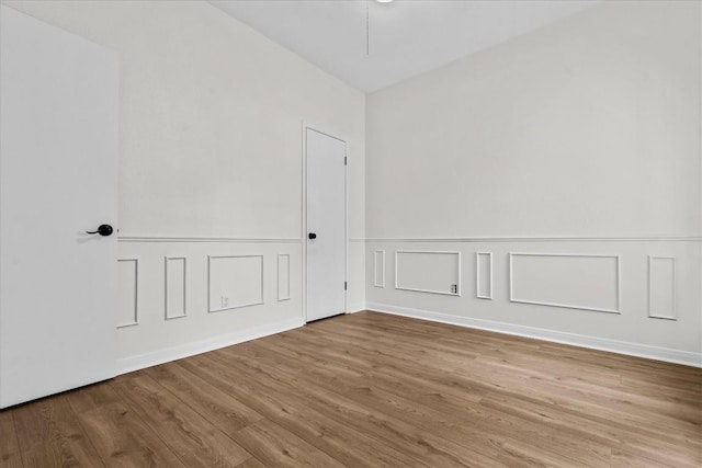 spare room featuring hardwood / wood-style floors