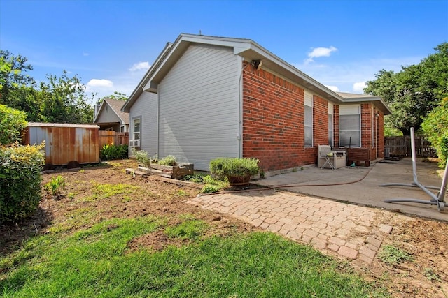 view of property exterior featuring a patio area