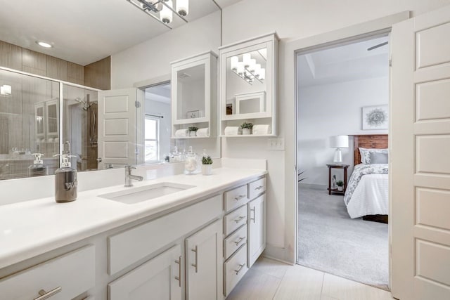 bathroom featuring tile patterned floors, vanity, and walk in shower