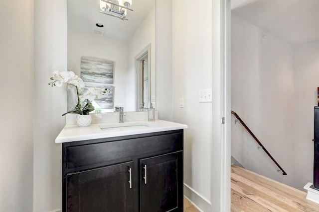 bathroom featuring hardwood / wood-style floors and vanity