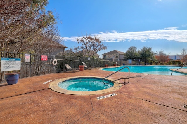 view of pool with a community hot tub