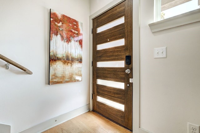 doorway with light wood-type flooring