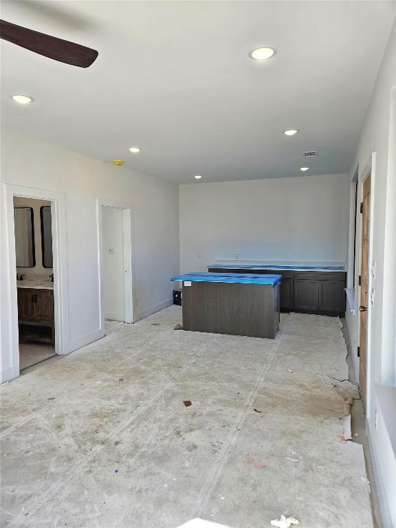 interior space featuring a hot tub and ceiling fan