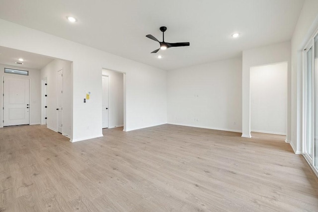 unfurnished living room with ceiling fan and light wood-type flooring