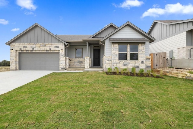 view of front facade with a front yard and a garage