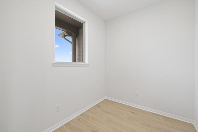 spare room featuring light wood-type flooring