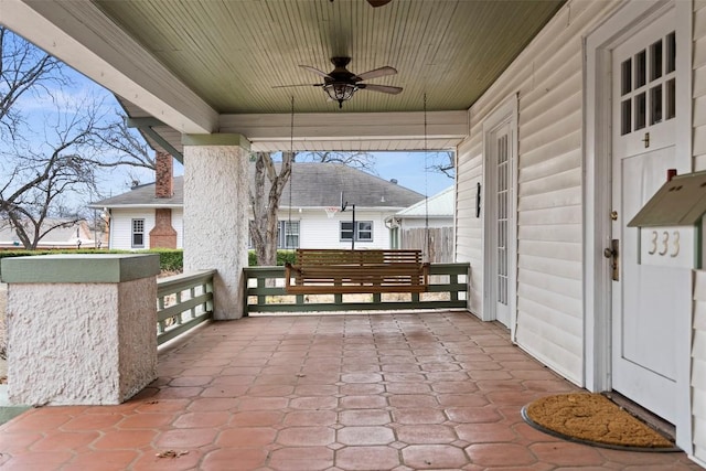 view of patio / terrace with ceiling fan and a porch