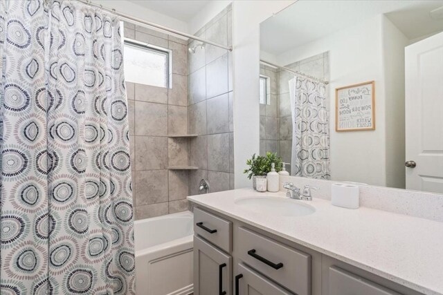 bathroom with vanity and shower / bath combo with shower curtain