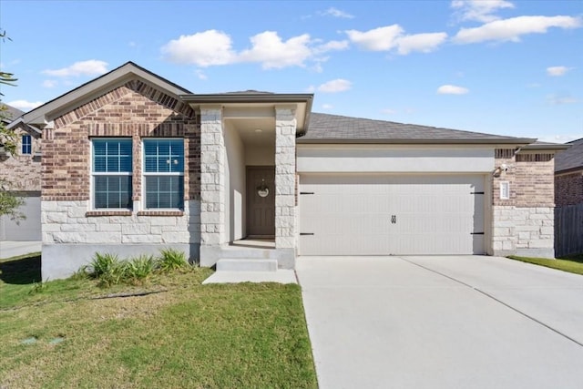 view of front of property featuring a front yard and a garage