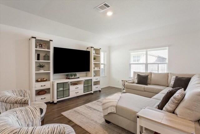 living room with dark hardwood / wood-style floors