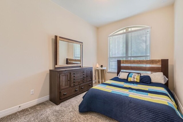 bedroom with light carpet