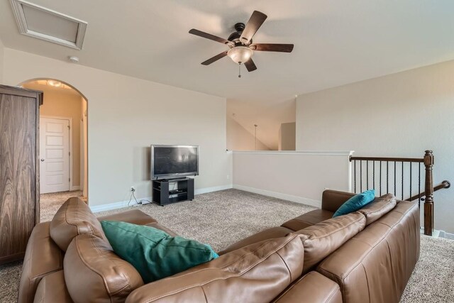 living room with light carpet and ceiling fan