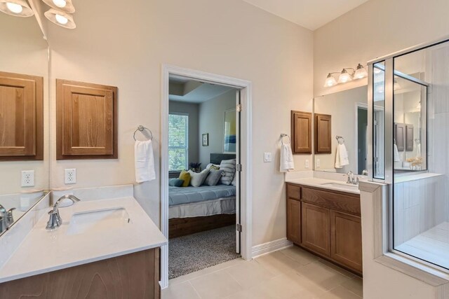 bathroom with vanity, tile patterned floors, and walk in shower